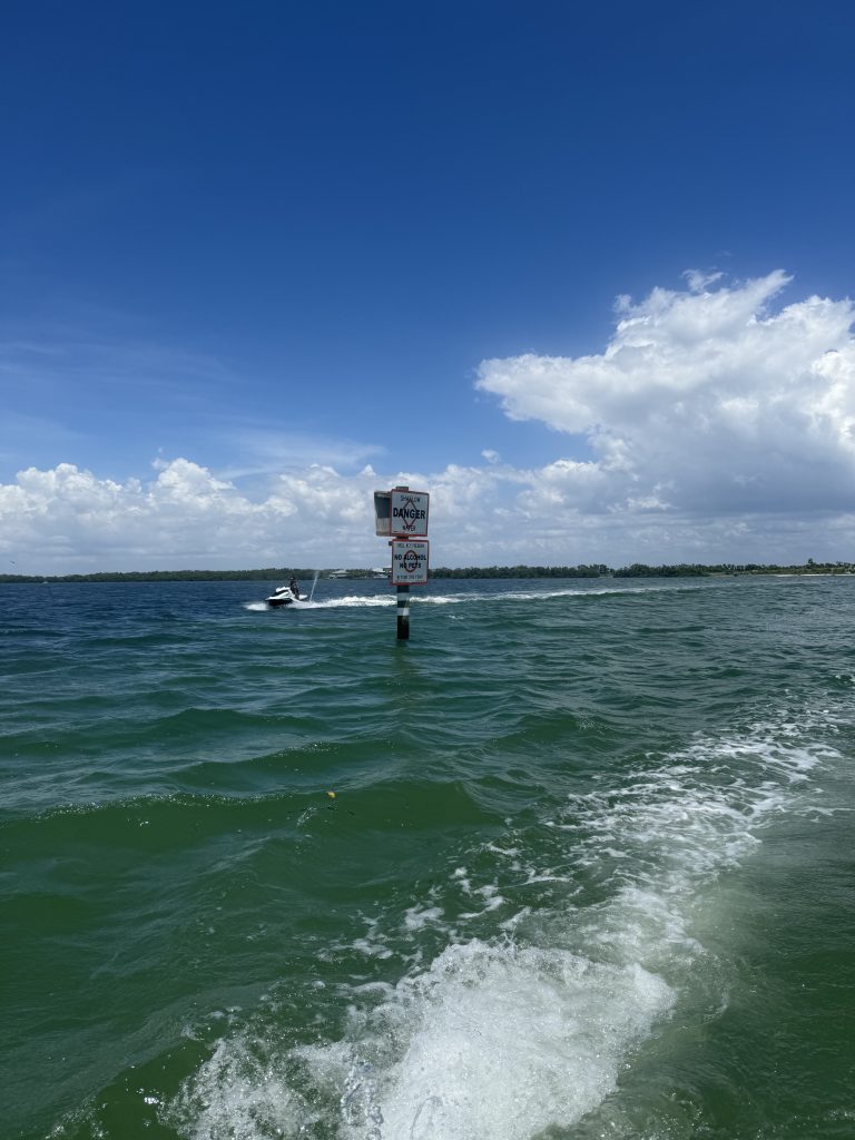 Jet skis cruising past the skyline and beaches of Tampa Bay.